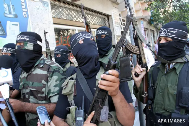 Palestinian militants of the Nasser Salah al-Din Brigades, delivers speech in a press conference, in Gaza city on Aug. 22, 2011. Photo by Mohammed Asad