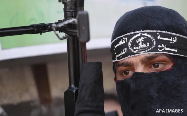 Palestinian militants of the Nasser Salah al-Din Brigades the military wing of the Popular Resistance Committees take part in a press conference, in Gaza city on Aug. 22, 2011 to announce a temporary halt of rocket fire...