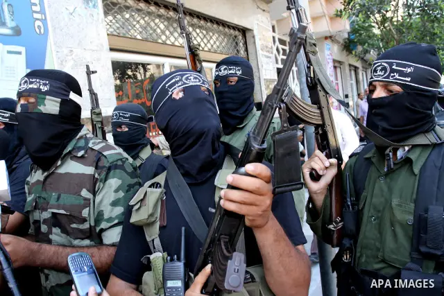 Palestinian militants of the Nasser Salah al-Din Brigades the military wing of the Popular Resistance Committees take part in a press conference, in Gaza city on Aug. 22, 2011 to announce a temporary halt of rocket fire...