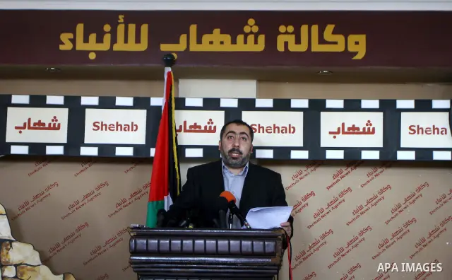 The spokesman of the Palestinian government in Gaza Strip, Taher al-Nono speaks to media in a press conference, in Gaza city on Aug. 22, 2011, to announce about "reached an understanding on a truce and that the truce has...