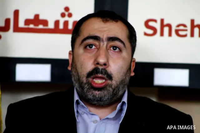 The spokesman of the Palestinian government in Gaza Strip, Taher al-Nono speaks to media in a press conference, in Gaza city on Aug. 22, 2011, to announce about "reached an understanding on a truce and that the truce has...