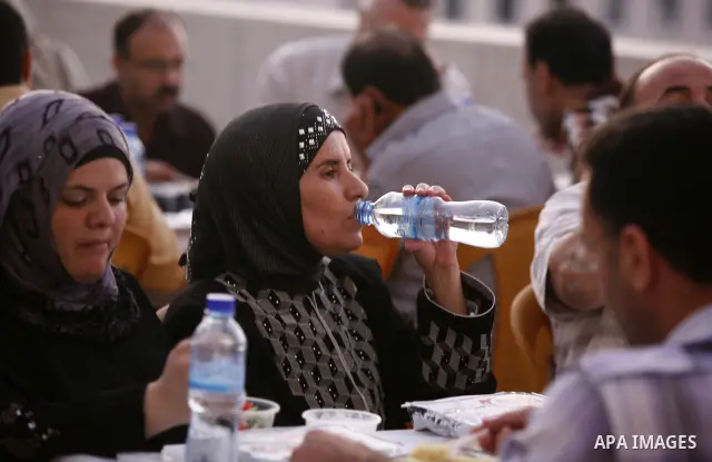 Palestinians take part in the Central Ramadan breakfast for the first orphanage, organized by the United Arab Emirates State charity , in the West Bank city of Nablus, monday Aug . 22,2011. Muslims throughout the world a...