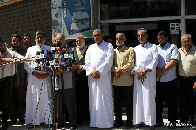 Members of the Palestinian Islamic Jihad deliver speech in a press conference in Gaza city on Aug. 23, 2011 in support with the Libyan rebels . Photo by Mohammed Asad
