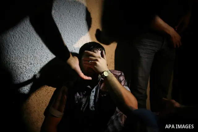 Palestinian relatives mourn over the body of Islamic Jihad militant Atia Moqat at El-shifa hospital after an Israeli air strike in Gaza City on 24 August 2011. Photo by Mahmud Nassar