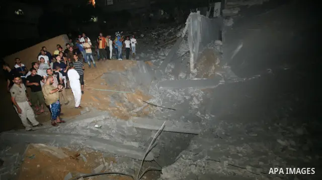 Palestinians inspect the damage at a club following an Israeli air strike in Gaza City, on Aug. 25, 2011. Israeli air strikes killed two Gaza militants, one a local commander of the Islamic Jihad group in the Gaza Strip,...