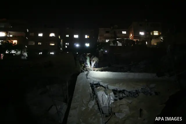 Palestinians inspect the damage at a club following an Israeli air strike in Gaza City, on Aug. 25, 2011. Israeli air strikes killed two Gaza militants, one a local commander of the Islamic Jihad group in the Gaza Strip,...