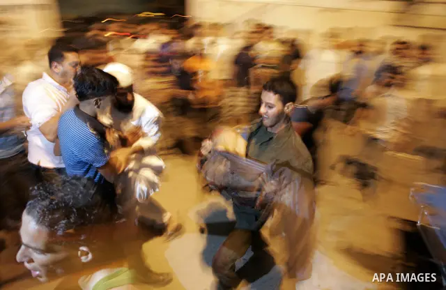 Palestinians doctors attend a wounded man at the Al Najar hospital following an Israeli air strike on a smuggling tunnel in Rafah, southern Gaza Strip, Thursday, Aug. 25, 2011. The Israeli military said its aircraft hit...