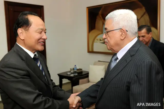 Palestinian President Mahmoud Abbas (Abu Mazen) meets with the Chinese envoy to the peace process in the Middle East, Woseeka in West Bank city of Ramallah on August 25, 2011. Photo by Mufeed Abu Hasnah
