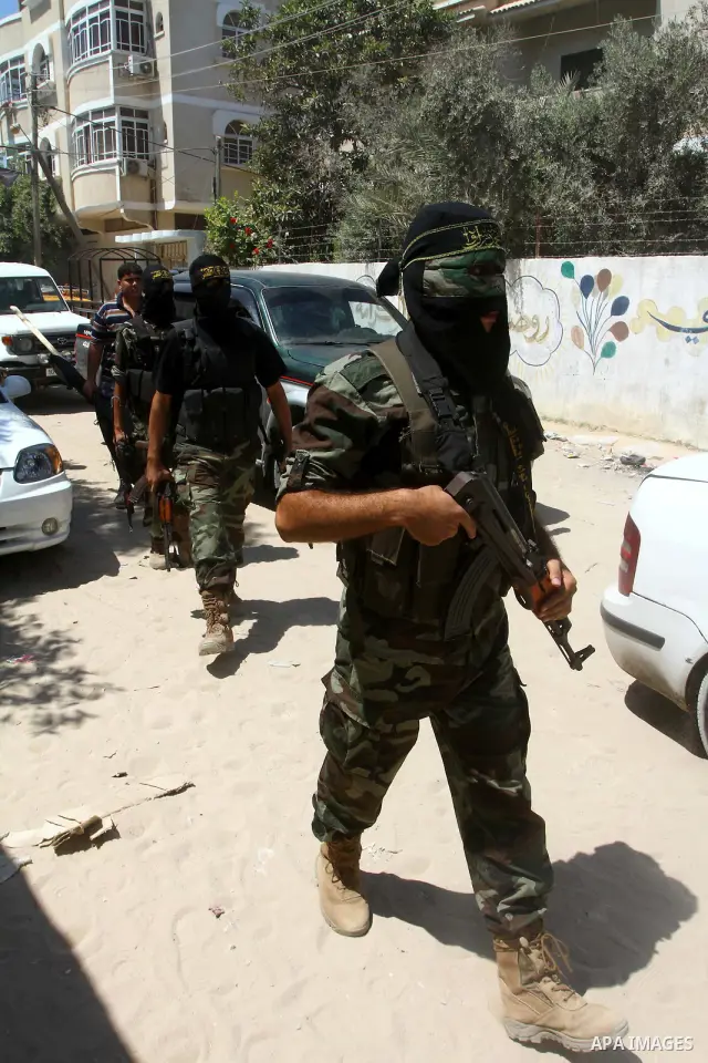 Palestinian militants of Islamic Jihad take part in the funeral of Alaa Hamdan and Saleem al-Arabid in Gaza City on August, 26,2011 after Palestinian groups in the Gaza Strip agreed on a new ceasefire after days of deadl...