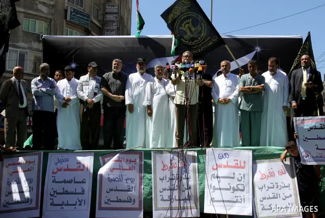 Palestinians take part in a protest as they mark Quds Day or Jerusalem Day in Gaza city, Friday, Aug. 26, 2011. The late Iranian leader Ayatollah Khomeni declared the last Friday of the Islamic fasting month of Ramadan a...