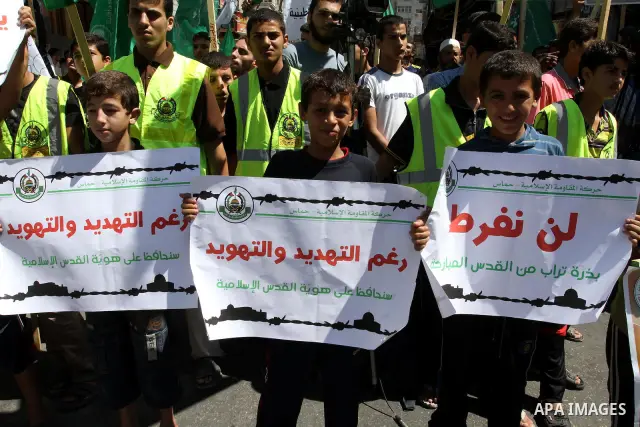 Palestinians take part in a protest as they mark Quds Day or Jerusalem Day in Gaza city, Friday, Aug. 26, 2011. The late Iranian leader Ayatollah Khomeni declared the last Friday of the Islamic fasting month of Ramadan a...