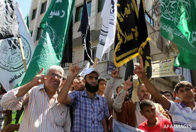 Palestinians take part in a protest as they mark Quds Day or Jerusalem Day in Gaza city, Friday, Aug. 26, 2011. The late Iranian leader Ayatollah Khomeni declared the last Friday of the Islamic fasting month of Ramadan a...