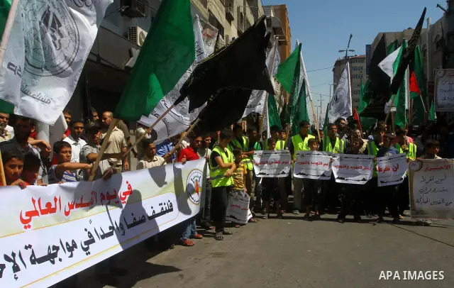 Palestinians take part in a protest as they mark Quds Day or Jerusalem Day in Gaza city, Friday, Aug. 26, 2011. The late Iranian leader Ayatollah Khomeni declared the last Friday of the Islamic fasting month of Ramadan a...