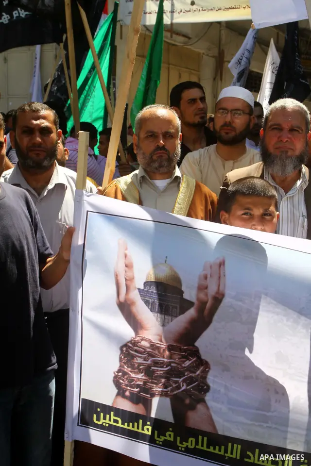 Palestinians take part in a protest as they mark Quds Day or Jerusalem Day in Gaza city, Friday, Aug. 26, 2011. The late Iranian leader Ayatollah Khomeni declared the last Friday of the Islamic fasting month of Ramadan a...