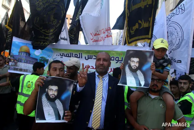Palestinians take part in a protest as they mark Quds Day or Jerusalem Day in Gaza city, Friday, Aug. 26, 2011. The late Iranian leader Ayatollah Khomeni declared the last Friday of the Islamic fasting month of Ramadan a...