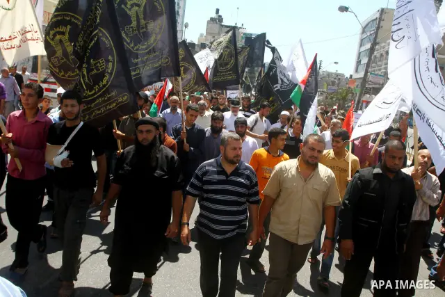 Palestinians take part in a protest as they mark Quds Day or Jerusalem Day in Gaza city, Friday, Aug. 26, 2011. The late Iranian leader Ayatollah Khomeni declared the last Friday of the Islamic fasting month of Ramadan a...