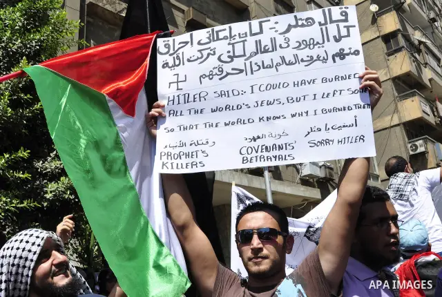 Egyptian protesters shout slogans against Israel during a protest in front of the Israeli Embassy in Cairo, Egypt, Friday, Aug.26, 2011. Hundreds of Egyptians protest the deaths of Egyptian security forces killed in a sh...