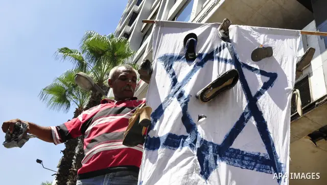 Egyptian protesters shout slogans against Israel during a protest in front of the Israeli Embassy in Cairo, Egypt, Friday, Aug.26, 2011. Hundreds of Egyptians protest the deaths of Egyptian security forces killed in a sh...