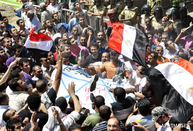 Egyptian protesters shout slogans against Israel during a protest in front of the Israeli Embassy in Cairo, Egypt, Friday, Aug.26, 2011. Hundreds of Egyptians protest the deaths of Egyptian security forces killed in a sh...