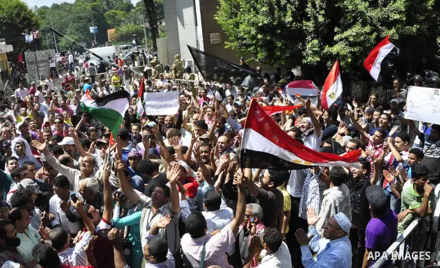 Egyptian protesters shout slogans against Israel during a protest in front of the Israeli Embassy in Cairo, Egypt, Friday, Aug.26, 2011. Hundreds of Egyptians protest the deaths of Egyptian security forces killed in a sh...
