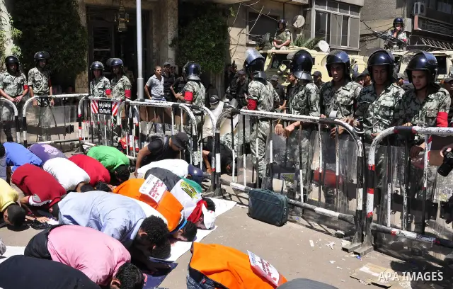 Egyptian protesters shout slogans against Israel during a protest in front of the Israeli Embassy in Cairo, Egypt, Friday, Aug.26, 2011. Hundreds of Egyptians protest the deaths of Egyptian security forces killed in a sh...