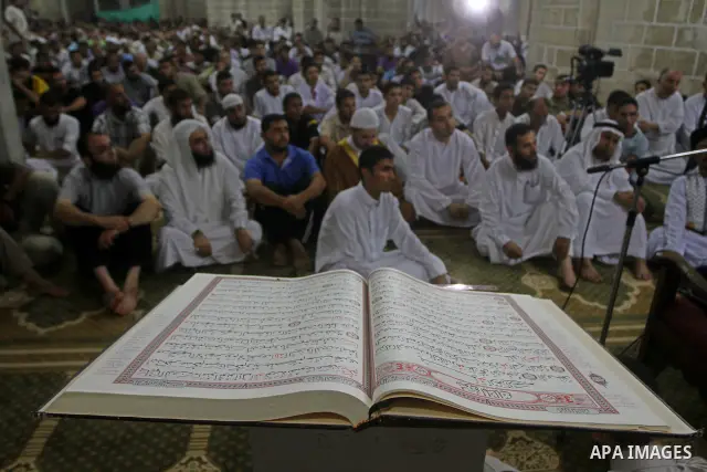 Palestinian Muslim worshippers pray during Laylat Al Qadr prayers on the 27th day of the holy fasting month of Ramadan in main mosque of Al Emari in Gaza City, Friday, Aug. 27, 2011. Laylat Al Qadr, the most important pr...