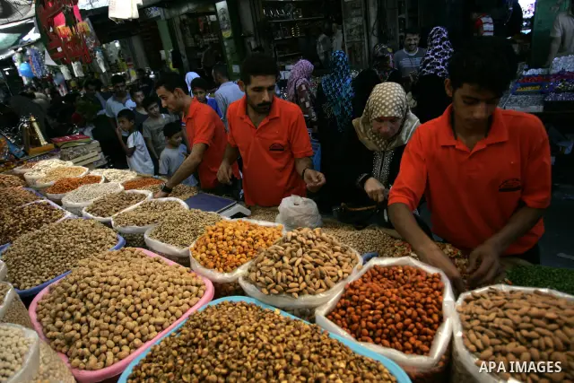 Palestinians shop for food as Muslims shop ahead of the Eid al-Fitr celebrations in Rafah, southern Gaza Strip on Aug. 28, 2011. Muslims in the region will celebrate the Eid al-Fitr holiday starting with the sighting of...