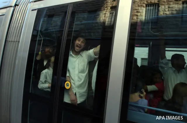 Palestinian and israeli Passengers ride a light rail train, Ten days after opened to the public in Jerusalem, on Aug. 29, 2011. The Jerusalem municipality said that a long-awaited light rail system is beginning operation...