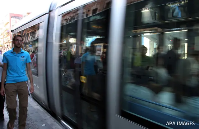 Palestinian and israeli Passengers ride a light rail train, Ten days after opened to the public in Jerusalem, on Aug. 29, 2011. The Jerusalem municipality said that a long-awaited light rail system is beginning operation...