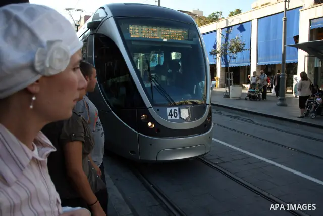 Palestinian and israeli Passengers ride a light rail train, Ten days after opened to the public in Jerusalem, on Aug. 29, 2011. The Jerusalem municipality said that a long-awaited light rail system is beginning operation...