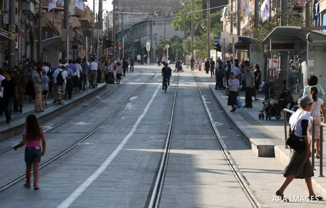 Palestinian and israeli Passengers ride a light rail train, Ten days after opened to the public in Jerusalem, on Aug. 29, 2011. The Jerusalem municipality said that a long-awaited light rail system is beginning operation...