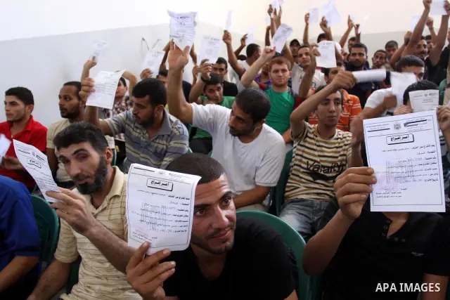 Palestinian prisoners prepare to be freed from a Hamas-run jail in Gaza City on Aug. 29, 2011. Palestinian Hamas police released prisoners because of the approaching Eid al-Fitr. Photo by Mohammed Asad
