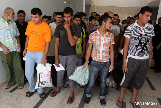 Palestinian prisoners prepare to be freed from a Hamas-run jail in Gaza City on Aug. 29, 2011. Palestinian Hamas police released prisoners because of the approaching Eid al-Fitr. Photo by Mohammed Asad
