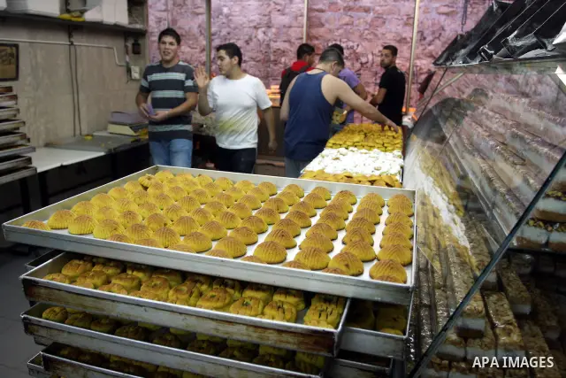 A Palestinian vendor prepares date-filled mini cakes traditional for the Eid al-Fitr, at his shop in the Old City in Jerusalem on Aug. 29, 2011. as Muslims the world over prepare to celebrate Eid al-Fitr, starting with t...