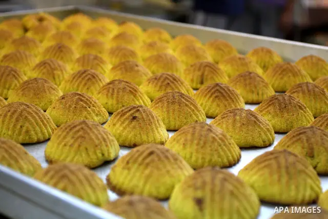 A Palestinian vendor prepares date-filled mini cakes traditional for the Eid al-Fitr, at his shop in the Old City in Jerusalem on Aug. 29, 2011. as Muslims the world over prepare to celebrate Eid al-Fitr, starting with t...
