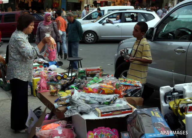 Palestinian Muslims shop in downtown Ramallah in the West Bank on August 29, 2011, ahead of the upcoming Eid al-Fitr which marks the end of the holy month of Ramadan. Photo by Issam Rimawi