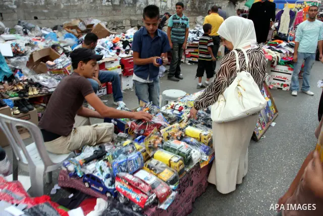 Palestinian Muslims shop in downtown Ramallah in the West Bank on August 29, 2011, ahead of the upcoming Eid al-Fitr which marks the end of the holy month of Ramadan. Photo by Issam Rimawi