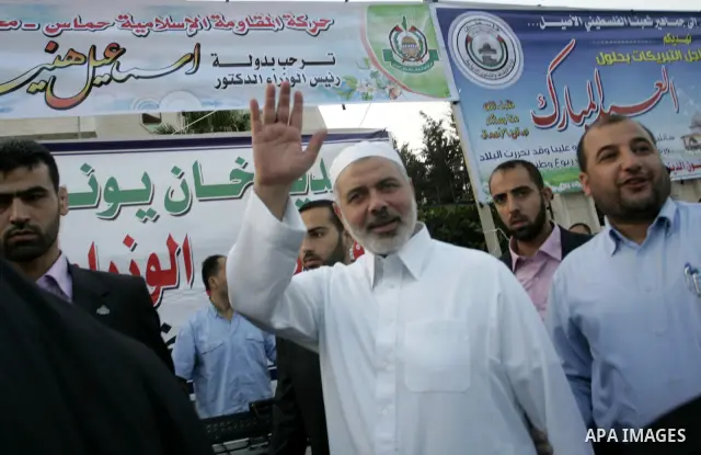 Ismail Haniya, Palestinian Prime Minister in the Gaza Strip, waves to the crowds after an open air morning prayer to celebrate Eid al-Fitr in Khan Yunis town the southern Gaza Strip on August 30, 2011. The Palestinian Te...