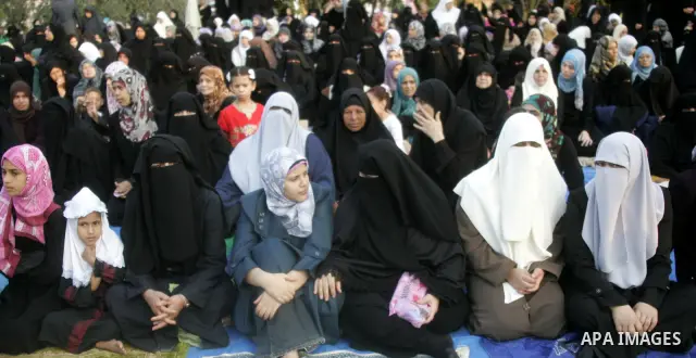 Palestinians attend an open air morning prayer to celebrate Eid al-Fitr in Khan Yunis town the southern Gaza Strip on August 30, 2011. The Palestinian Territories, along with other neighboring and Gulf states, announced...