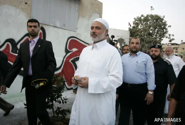 Ismail Haniya, Palestinian Prime Minister in the Gaza Strip, walks after an open air morning prayer to celebrate Eid al-Fitr in Khan Yunis town the southern Gaza Strip on August 30, 2011. The Palestinian Territories, alo...