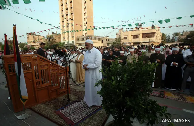 Ismail Haniya, Palestinian Prime Minister in the Gaza Strip, attends an open air morning prayer to celebrate Eid al-Fitr in Khan Yunis town the southern Gaza Strip on August 30, 2011. The Palestinian Territories, along w...