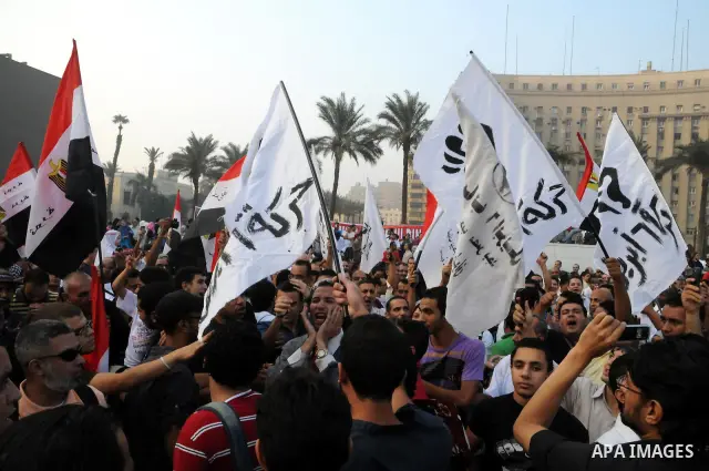 Egyptian Muslims gather to pray, celebrating the start of the three-day feast known in Arabic Eid al-Fitr, which marks the end of the holy fasting month of Ramadan, in Tahrir Square, the scene of mass demonstration which...