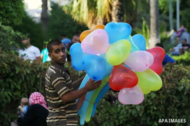 Palestinian children enjoy a ride at an amusement park on the second day of the Eid al-Fitr holiday, which marks the end of the holy fasting month of Ramadan in Gaza City, on August 31 2011. Photo by Ashraf Amra