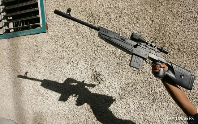 Palestinian boys play with toy guns on the third day of the Eid al-Fitr holiday in Rafah Refugee Camp in the southern Gaza Strip on 01 September 2011. Eid marks the end of the holy month of Ramadan. Photo by Abed Rahim K...