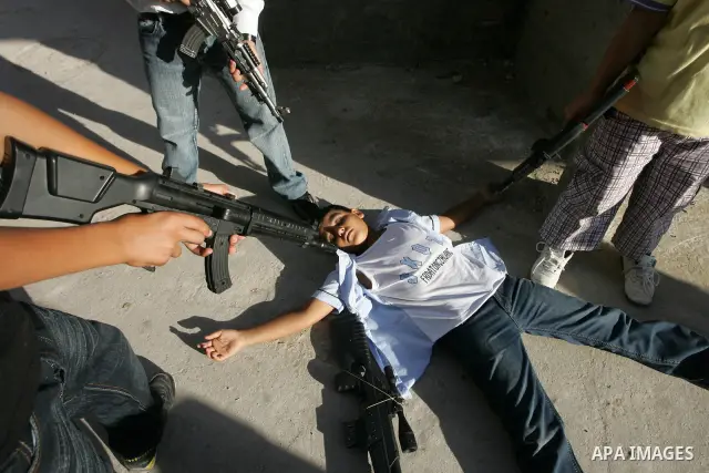 Palestinian boys play with toy guns on the third day of the Eid al-Fitr holiday in Rafah Refugee Camp in the southern Gaza Strip on 01 September 2011. Eid marks the end of the holy month of Ramadan. Photo by Abed Rahim K...