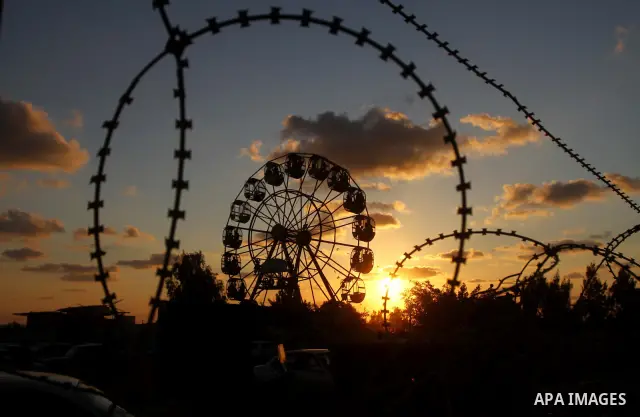 Palestinian children enjoy a ride at an amusement park on the third day of the Eid al-Fitr holiday, which marks the end of the holy fasting month of Ramadan in Gaza city on Sept. 1,2011. Photo by Ashraf Amra