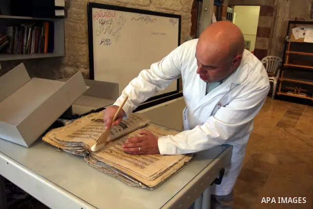 Palestinians work to rewrite manuscripts in the Manuscript Center at Al-Aqsa Mosque in Jerusalem on September 2, 2011 .The Manuscript Center Aqsa Mosque first of its kind in the Middle East and fourth in the world, as cl...