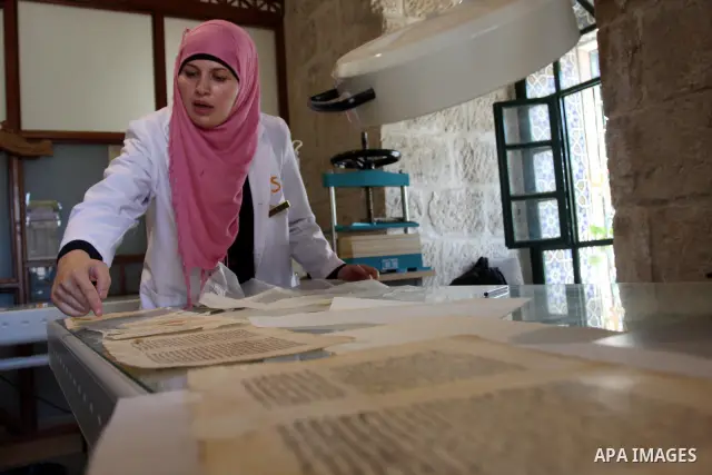 Palestinians work to rewrite manuscripts in the Manuscript Center at Al-Aqsa Mosque in Jerusalem on September 2, 2011 .The Manuscript Center Aqsa Mosque first of its kind in the Middle East and fourth in the world, as cl...