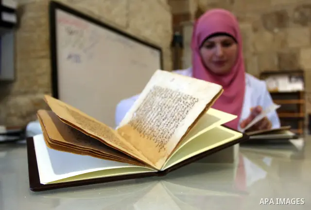 Palestinians work to rewrite manuscripts in the Manuscript Center at Al-Aqsa Mosque in Jerusalem on September 2, 2011 .The Manuscript Center Aqsa Mosque first of its kind in the Middle East and fourth in the world, as cl...