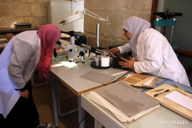 Palestinians work to rewrite manuscripts in the Manuscript Center at Al-Aqsa Mosque in Jerusalem on September 2, 2011 .The Manuscript Center Aqsa Mosque first of its kind in the Middle East and fourth in the world, as cl...
